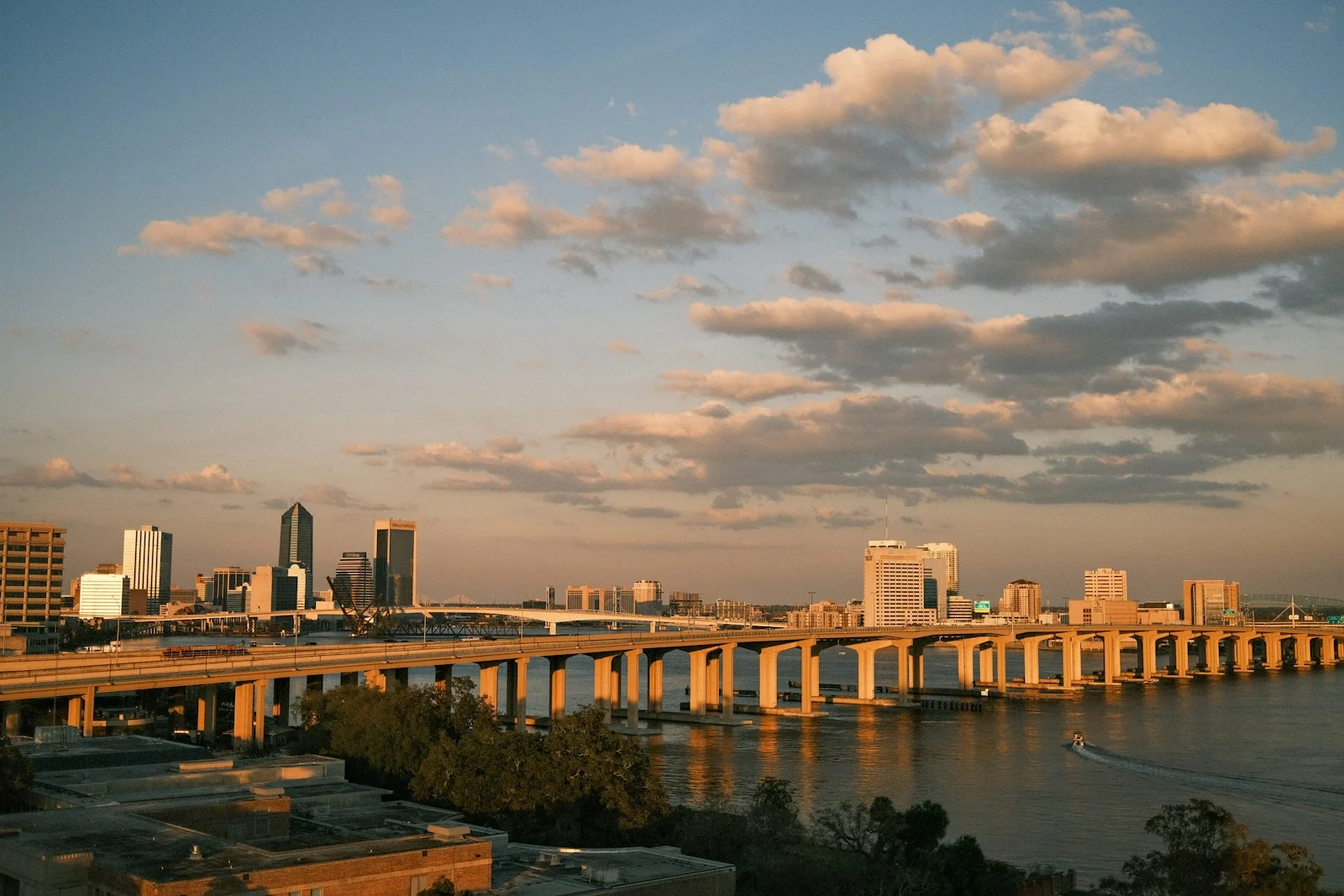 Downtown Jacksonville Florida skyline and bridge over the St. Johns River at sunset