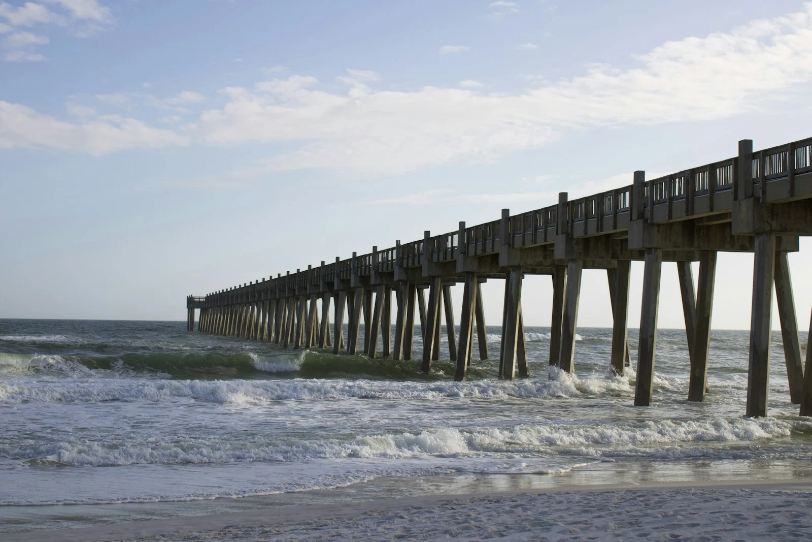 Pensacola Beach pier and Gulf of Mexico surf on the Florida panhandle